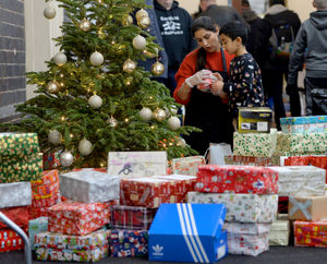 Tavneet Basir and five-year-old son Keerat sort out some of the gifts