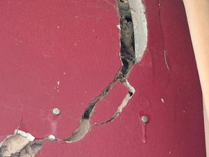 One of the large cracks in the home next to the proposed battery site, with they say proves how unstable land in the area is. Picture: LDRS