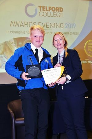 James Halbert receives his award from vice principal Janet Stephens