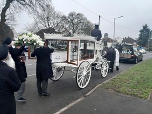 The white horse-drawn carriage that transported the body of Gurdas Ram