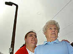 Supporting image for story: Street in dark over lights switch-on