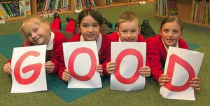 Market Drayton Infant School pupils, from left, Layla Marshall, Jessica Bates, Jacob Savill and Isabel Coombes celebrate the schools good Ofsted report