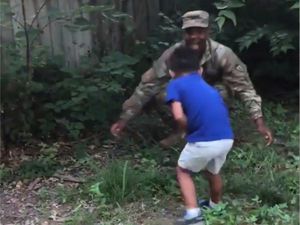 Supporting image for story: This soldier filmed his four-year-old’s reaction to his return after 288 days