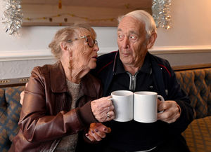 Mary Fulford and brother Alan Page share a cup of tea as they listen to the music
