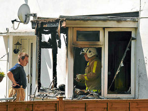 Supporting image for story: Living room gutted by fire while owners out