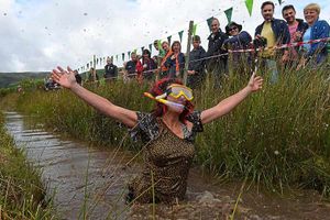 A competitor celebrates after taking part
