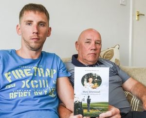 Son and father Craig and Clive Isherwood with the order of service from Mrs Isherwood's funeral