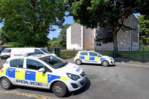 Police in St Thomas Close, Coalpool, where Mr Bradley died