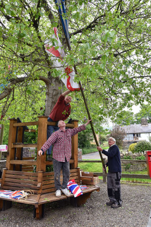 Paul Sweetland, Andy Marsden and Terry Bateman prepare the flags. Picture: David Bagnall