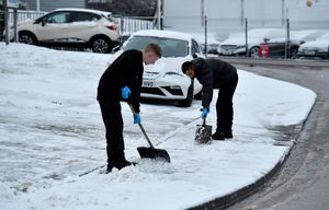 People shovelling snow in Walsall 