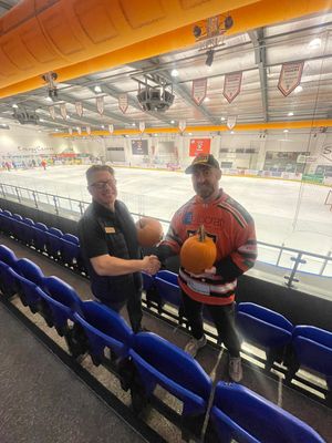 Volvo Shrewsbury donating a pumpkin to the Telford Tigers