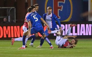 Charlie Lakin floored after challenging for the ball.