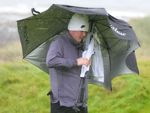 Supporting image for story: Robert MacIntyre battles brutal conditions to take share of lead on home soil