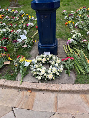Flowers adorning the grass outside Birmingham Cathedral