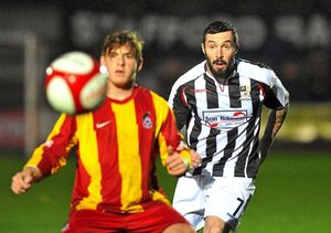 Jon Adams keeps a close eye on his opponent's control