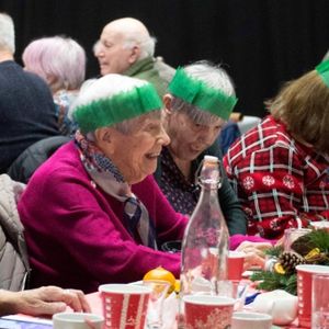 Party goes enjoying festive bingo.