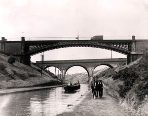 A horse drawn cargo being led beneath Galton Bridge, Smethwick, in the 1930s