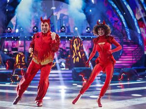 Katya Jones and Wynne Evans dancing in red devil costumes on Strictly