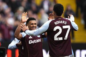 Aston Villa's Ollie Watkins (left) celebrates scoring their side's second goal of the game with team-mate Morgan Rogers