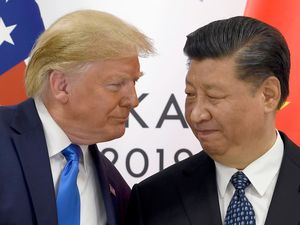 Donald Trump, left, meets with Chinese President Xi Jinping during a meeting on the side-lines of the G-20 summit in Osaka, Japan