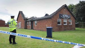 Tthe burnt out building with collapsed roof