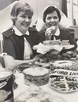 RAF Cosford Hospital. A bazaar was held to raise funds for the League of Friends. The photograph shows (left) Christine Heginbotham and Jane Milk selling cakes in November 1976.