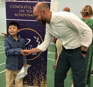 Timmy Xie receives congratulations from Severn Academies Educational Trust acting chiefexecutive Matthew Carpenter