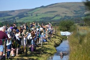 Lots of spectators stood along the length of the bog to cheer on the brave competitors.