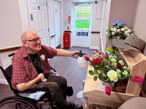 Dovedale Court Care Home’s resident Gordon Small at dementia friendly community florist station