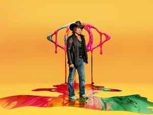 Mickey Rourke in front of Big Brother logo