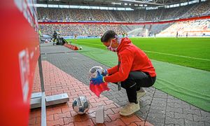 Footballs are disinfected during the Bundesliga soccer match between Duesseldorf and  Paderborn in the Merkur Spiel-Arena, Duesseldorf, Germany, Saturday, May 16, 2020. The German Bundesliga becomes the world's first major soccer league to resume after a two-month suspension because of the coronavirus pandemic.