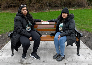 Ronan's sister Nikita and mum Pooja on the bench which bears his name.