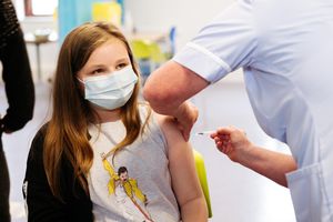 Emmy Jones, 11, receiving her jab