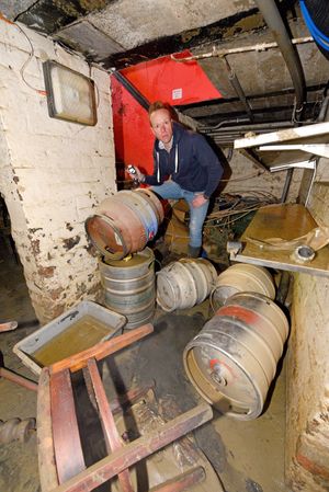 Ollie Parry surveying the damage to his cellar at The Salopian Bar in Shrewsbury