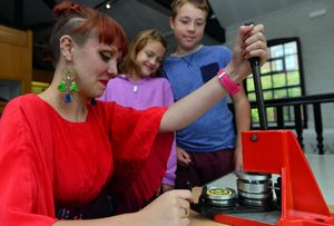 August 2015 - Pictures from a fun day event taking place at the Walsall Leather Museum. Badge maker Freya Cox is pictured with Paige Coley (9) and her brother Jacob Coley (11)
