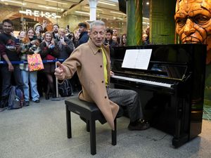 Jeff Goldblum at a piano at St Pancras station