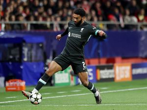 Liverpool defender Joe Gomez keeps the ball in on the touchline