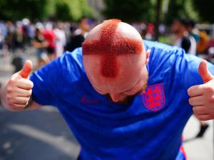 Supporting image for story: Barber who shaved St George cross into his hair among fans in Berlin