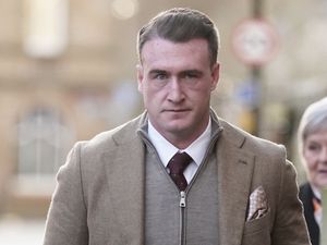 Head and shoulders photo of Stuart Hogg wearing shirt, tie and overcoat