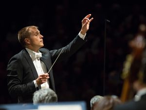 Vasily Petrenko conducting an orchestra