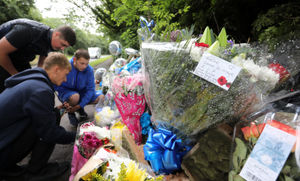 People gathering at the scene of the fatal crash in Bosty Lane, Aldridge, where a 17-year-old died on Friday.
