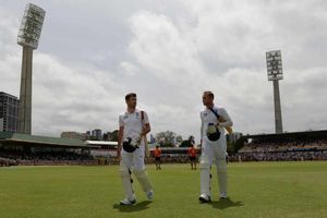England's James Anderson (left) and Stuart Broad (right) leave the field following their loss of the match and the Ashes