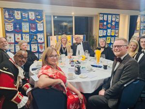 The top table Guests (from left to right)  Rugeley Town Chair Councillor Jane LeadBeater, Town Crier Adrian Basford, 2nd Vice District Governor, Lion Secretary Sue Topping, Lion President Debra Coburn, Mr Eric Passey, Lion Jane Pallister, Councillor Olivia Lyons-Hughes, Mr Robert Hughes, MP Josh Newbury. 