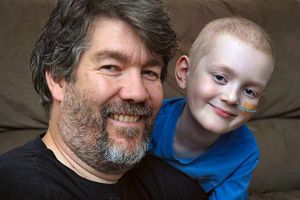 Father Jason, who has set up a Facebook group for Josh, with his son.