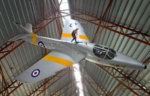 Johnny Sutherland from Totally Wild Access cleans one of the aircraft at RAF Cosford Museum.