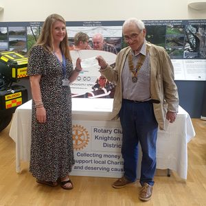 Amy Johnson from St Michael's Hospice receiving a cheque from Rotary President Robert Wayne
