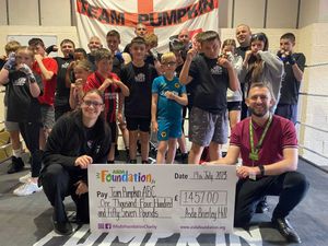 Team Pumpkin celebrate landing the Asda cheque