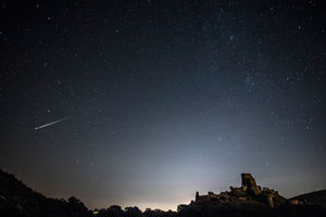 A meteor shoots across the night sky in the UK.