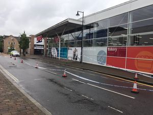 A closure outside Tesco which is believed by police to have been the scene of an altercation before the crash