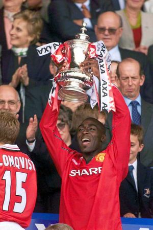 Andy Cole lifting the FA Cup for United